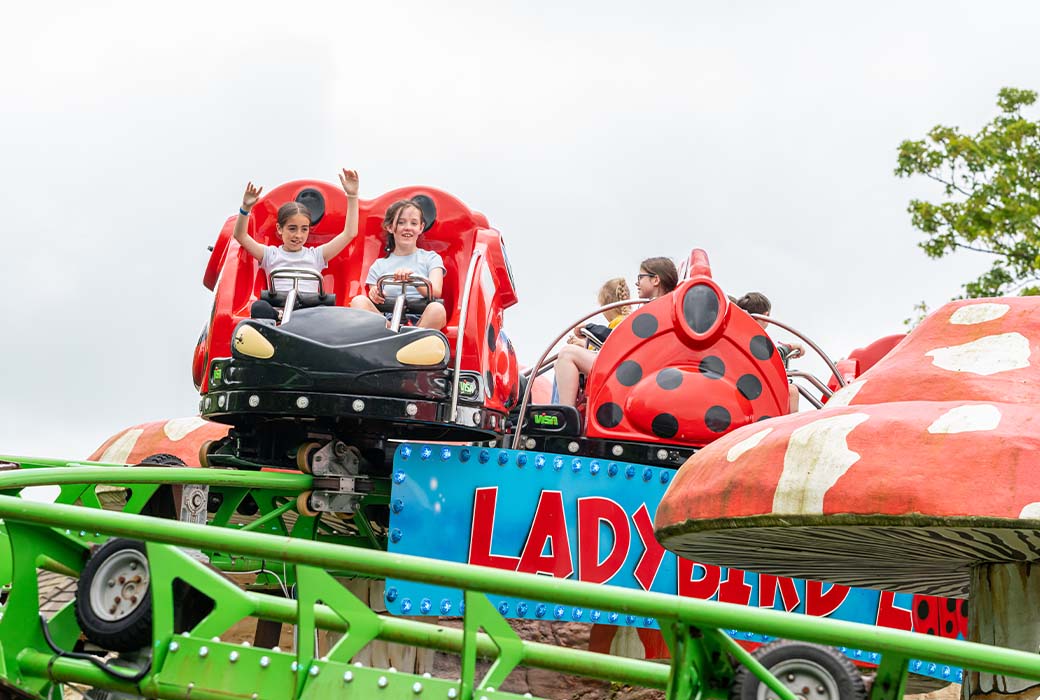 close up of children in the middle of ladybird loop ride emerald park