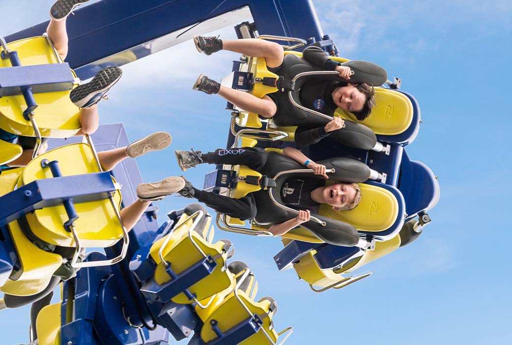 upside down view of children on theme park ride emerald park