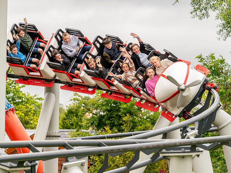 close up of children in the middle of a theme park ride at emerald park