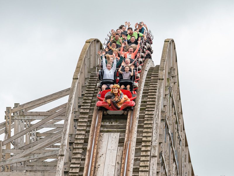 carriage with children at the top of cu chulainnn rollercoaster in emerald park