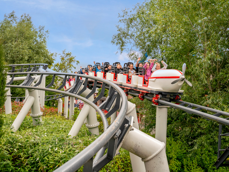 children sitting on the flight school ride at Emerald Park