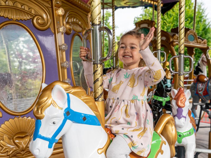 Close up of child on the Grand carousel.