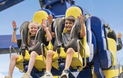 two children on a rollercoaster ride