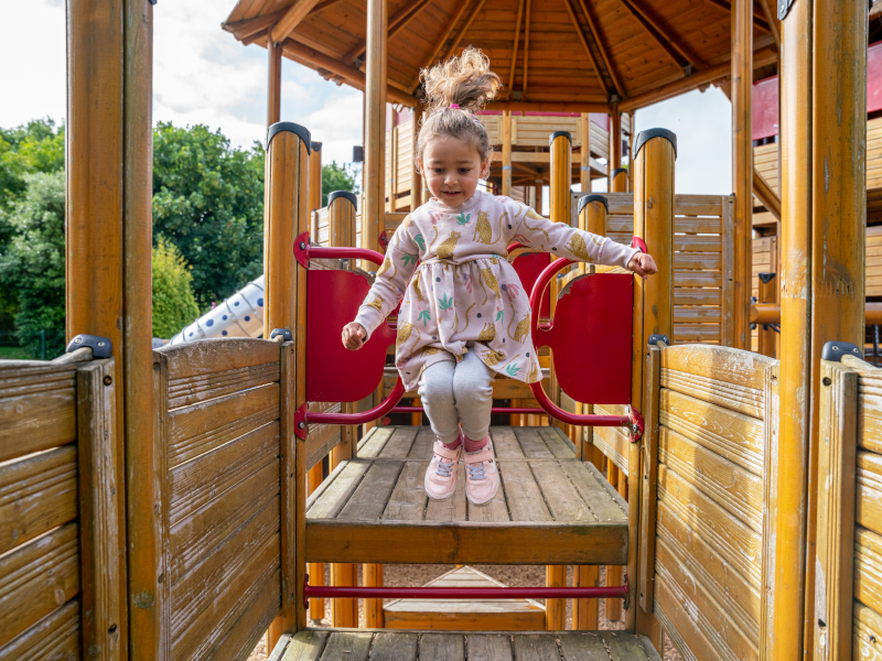 A child jumping in the playground