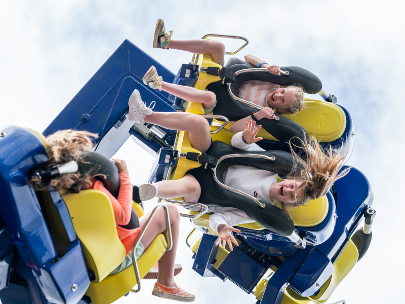 Children having fun on the power surge theme park ride