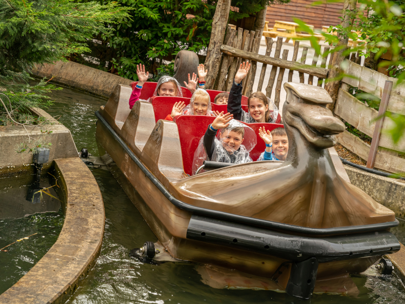 Children aboard the Viking voyage boat waving and having fun.