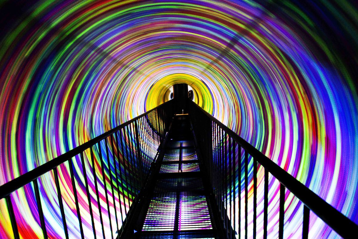 Inside the vortex tunnel with colourful lights all around