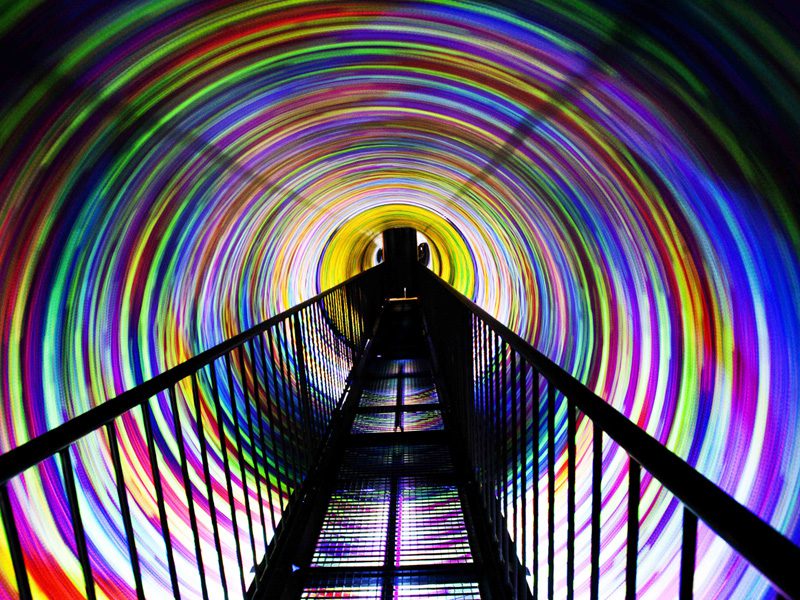 Inside the vortex tunnel with colourful lights all around
