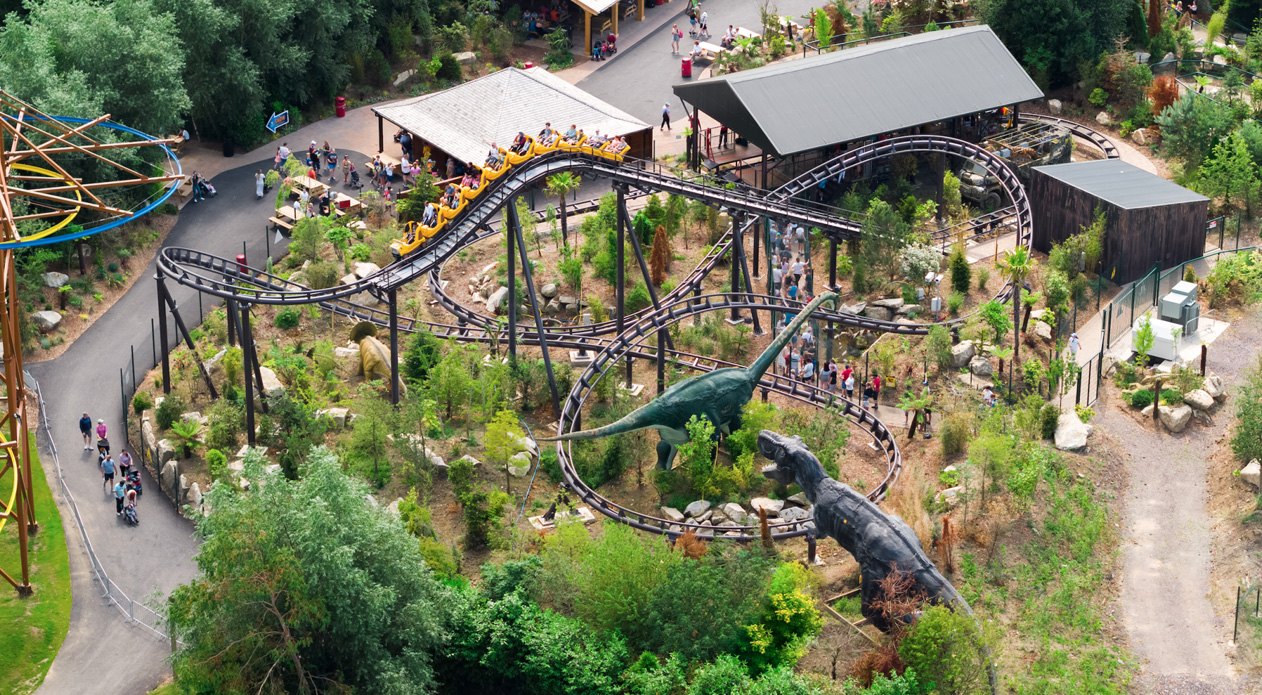 aerial view of theme park ride with dinosaurs