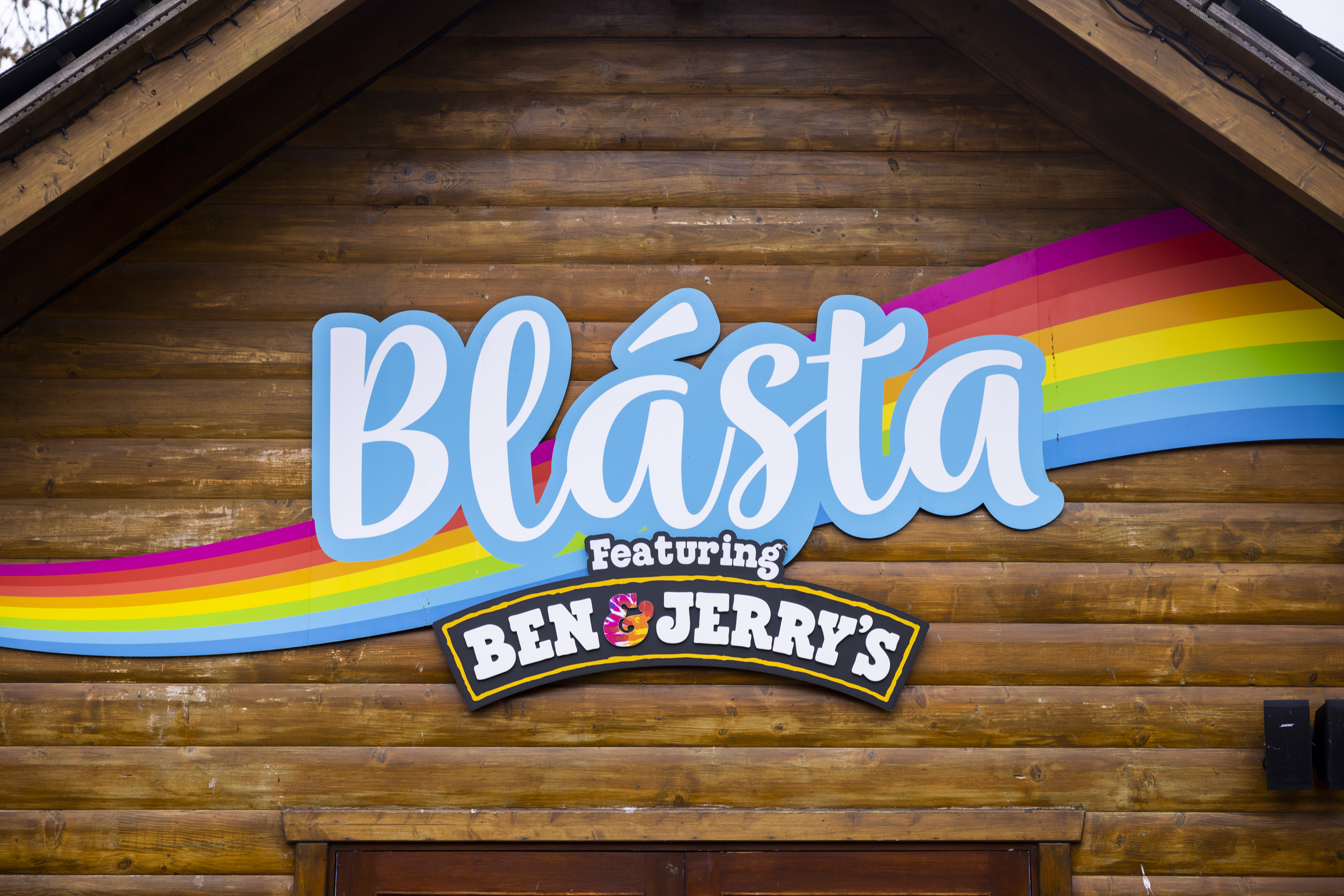 the outside of a wooden ice cream parlour called 'Blásta featuring Ben & Jerry's'