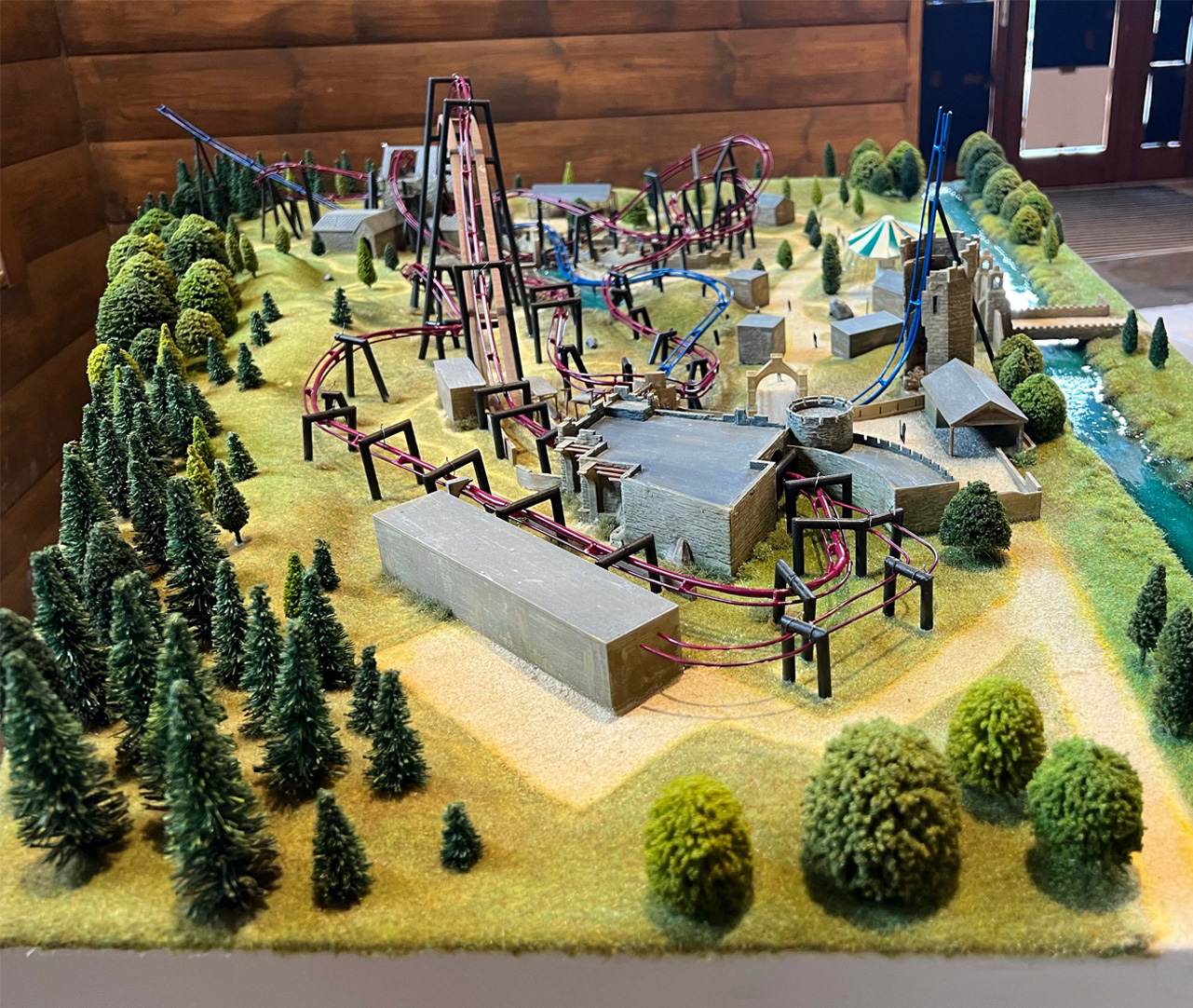 a model of a themed land at a theme park with two rollercoasters