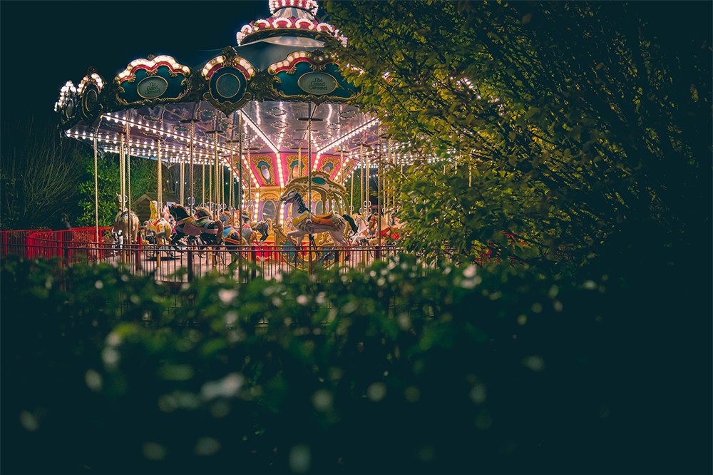 a carousel ride lit up at night time