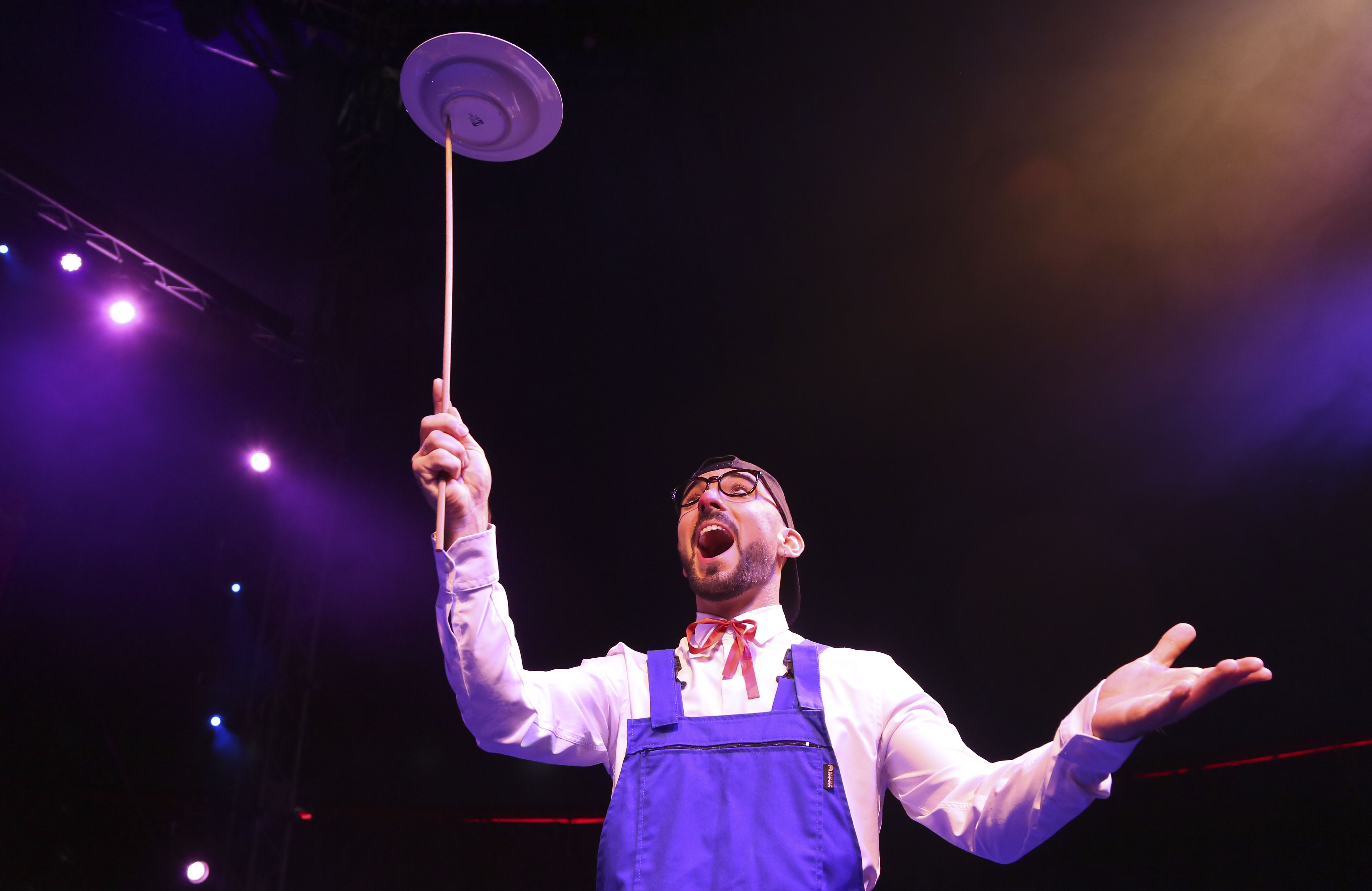 a clown spinning plates