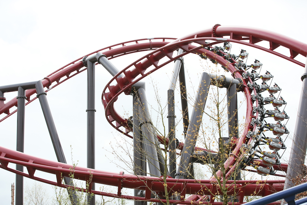 a red rollercoaster in action at Emerald Park