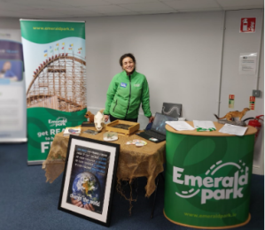 Emerald Park staff member at a recruitment drive with Emerald Park branded stand and pull up banner
